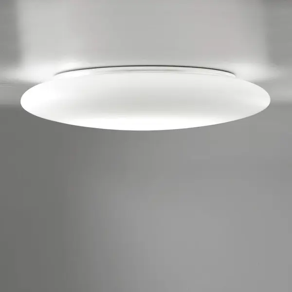 Wall-ceiling lamps with diffuser in mouth-blown, satin-finish opal triplex glass; matte white painted metal frame. The Mentos collection features a special magnet fixing system for the glass component which speeds up installation and simplifies maintenance operations. Suitable for indoor use only. Three sizes available.
