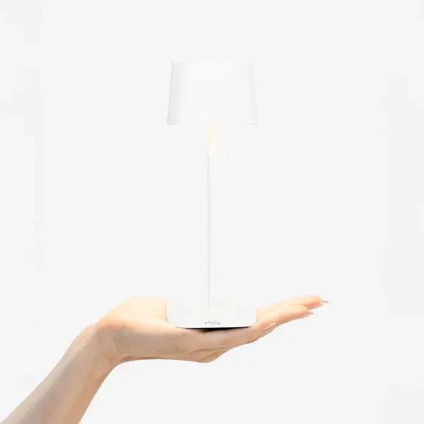 The Ofelia Pro Micro is a compact, rechargeable cordless table lamp perfect for flexible lighting anywhere. Features touch dimming, adjustable color temperature, and weather-resistant design for indoor and outdoor use. - alternate view