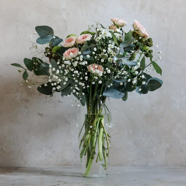 The Patéa Tall Convex Vase brings sophisticated coastal charm to any space with its handcrafted borosilicate glass construction and mollusk-inspired design. Featuring colorful spots and refined shapes, this practical yet elegant piece is thermal shock resistant, dishwasher safe, and microwave-friendly. - alternate view