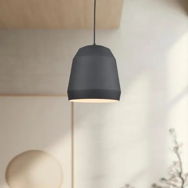 The Sedona pendant features a striking faceted aluminum shade with powder-coated black exterior and matte white interior. Its geometric design and cloth cable suspension create contemporary visual interest for kitchens and dining spaces. - alternate view