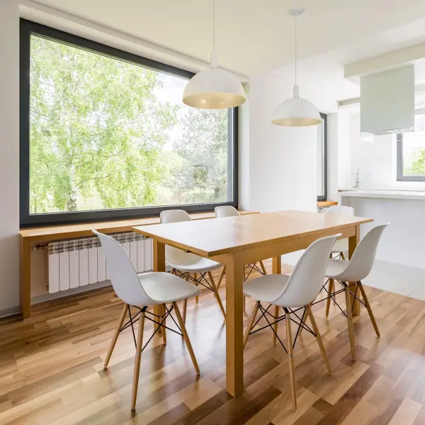The Archibald 24-inch pendant combines industrial-inspired design with modern sophistication. Its aluminum dome shade features a dramatic black exterior with gold detail accents and a matte white interior for optimal light reflection. - alternate view