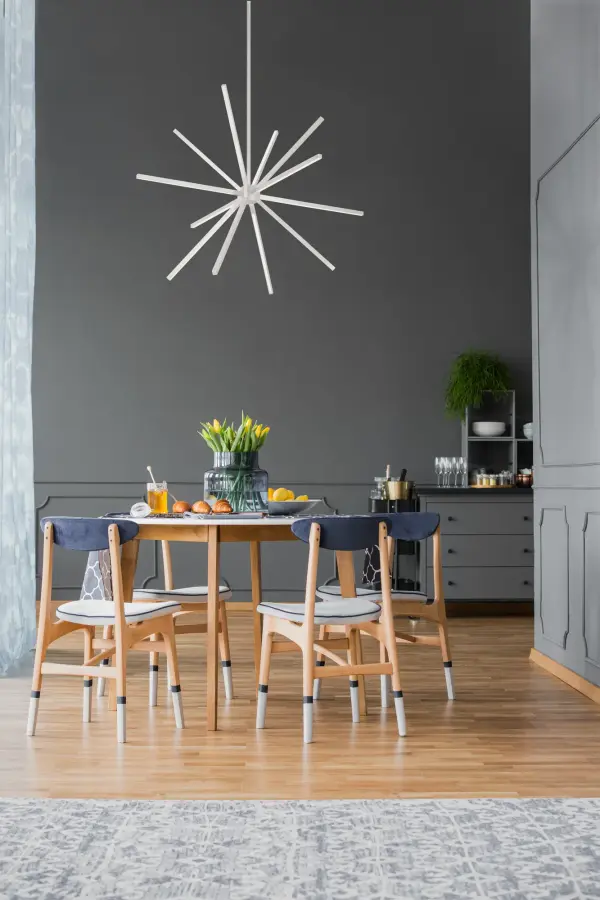 The Sirius Minor brings contemporary artistry to any space with its striking geometric design of converging linear LED lights. At 32 inches, this chandelier offers the perfect scale for versatile placement while maintaining dramatic visual impact. - alternate view