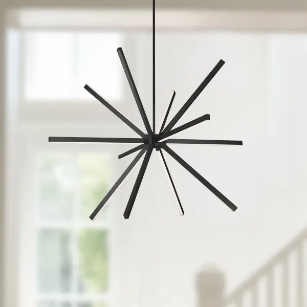 The Sirius 56-inch chandelier makes a bold architectural statement with its radiating starburst design. Integrated LED technology provides energy-efficient illumination while the burnished finish creates dynamic light play throughout the space. - alternate view