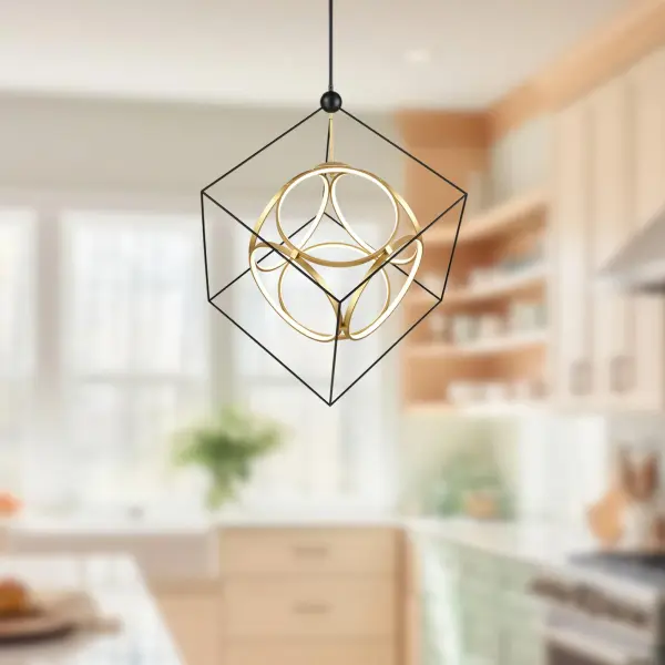 The Monza 34-inch chandelier features interconnecting aluminum rings within a steel cube frame, creating striking architectural interest. Dual-tone Black and Antique Brass finish adds sophisticated contrast while integrated 3000K LED provides warm, energy-efficient illumination. - alternate view