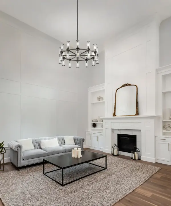 The Revolve chandelier brings timeless elegance with its antique candle-holder inspired design, featuring clear glass tubes and metal ring accents. At 33 inches, it makes a statement in dining rooms and foyers while maintaining versatility. - alternate view