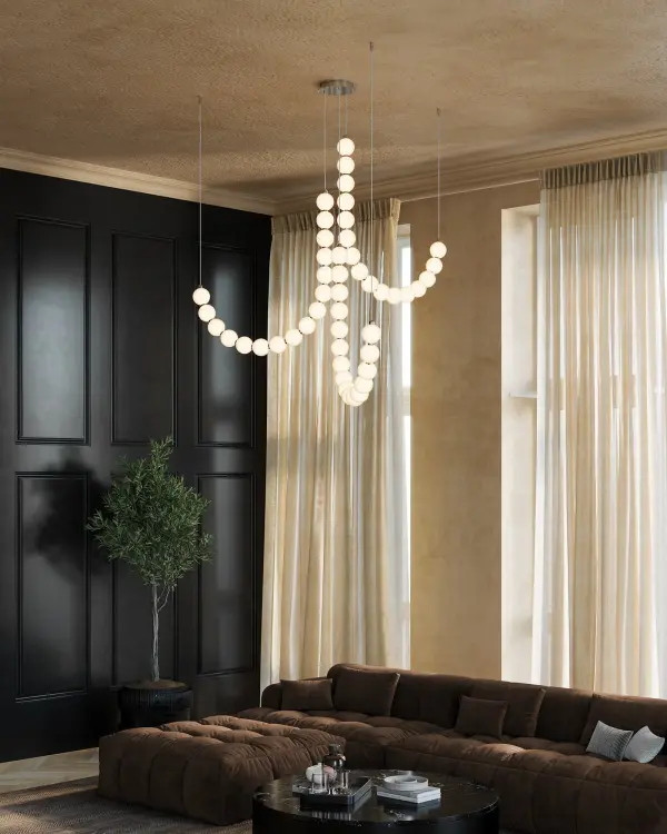 The Akoya chandelier brings coastal elegance indoors with its pearl-inspired beaded design and polished chrome finish. At 54 inches wide, this 3-head fixture creates a stunning focal point with integrated LED technology and unlimited configuration options. - alternate view