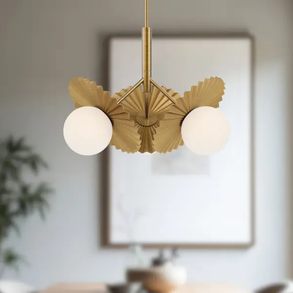 The Plume Chandelier brings fashion-forward sophistication to any space with its distinctive pleated decorative disk and generous opal glass globe. The brushed gold finish adds warmth while the contemporary silhouette keeps it fresh and versatile. - alternate view