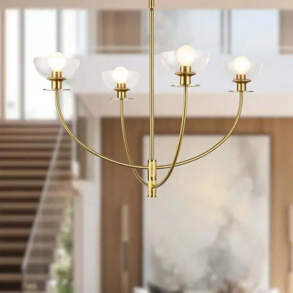 The Sylvia chandelier combines sinuous metal forms with delicate dome-shaped glass for a sophisticated, feminine aesthetic. Its brushed gold finish and nature-inspired curves create an opulent focal point perfect for modern and transitional interiors. - alternate view