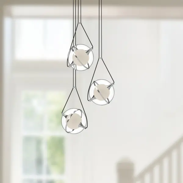 The Aries chandelier features a unique gyroscope-inspired design with floating spheres and integrated LED lighting. Its adjustable length up to 120 inches and frosted glass accents create a stunning statement piece for modern interiors. - alternate view