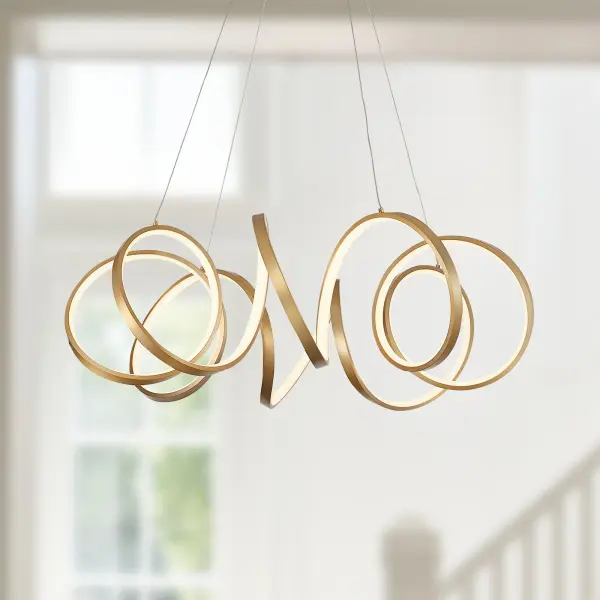 The Synergy chandelier features a striking continuous helical form with integrated LED lighting. Its rolled rectangular aluminum extrusion creates a dynamic sculptural presence while emitting soft, warm light through silicon opal lenses. - alternate view