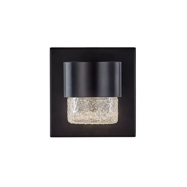 The Copenhagen wall sconce combines clean geometric lines with detailed translucent glass for a refined outdoor lighting solution. Its integrated LED provides warm illumination while the black finish creates striking contrast.