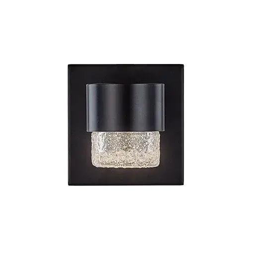 The Copenhagen wall sconce combines clean geometric lines with detailed translucent glass for a refined outdoor lighting solution. Its integrated LED provides warm illumination while the black finish creates striking contrast. - alternate view
