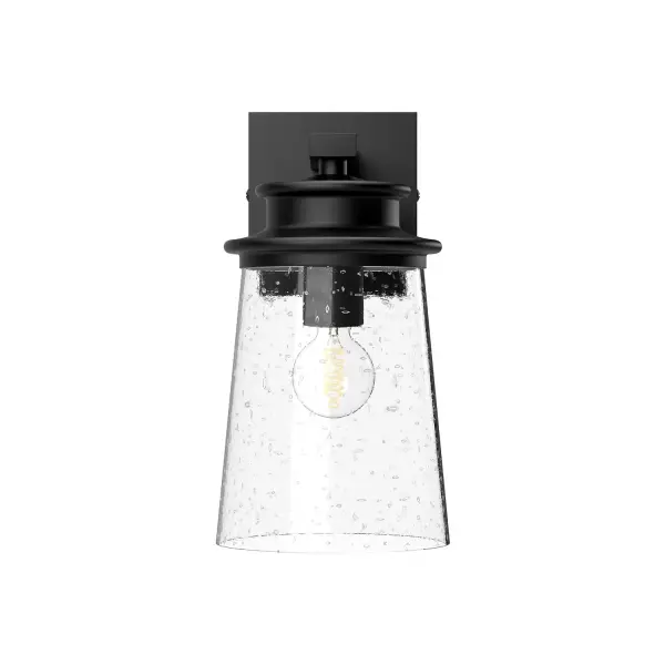 The Quincy wall sconce brings architectural elegance with its layered pagoda-inspired design in textured black finish. Clear bubble glass adds vintage charm while the versatile mounting works beautifully indoors or out.