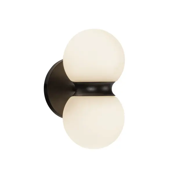 The Peri exterior wall sconce combines contemporary minimalist design with practical outdoor functionality. Its matte black finish and choice of ribbed or opal glass create sophisticated ambiance while integrated LED technology ensures energy efficiency and longevity.