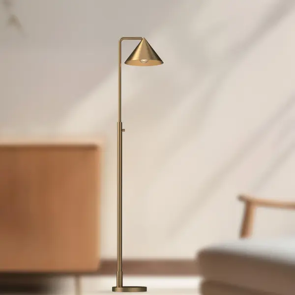 The Remy floor lamp brings Japandi aesthetics to modern interiors with its distinctive triangular shade and brushed gold finish. At 58 inches tall, it provides both ambient lighting and sculptural presence. - alternate view