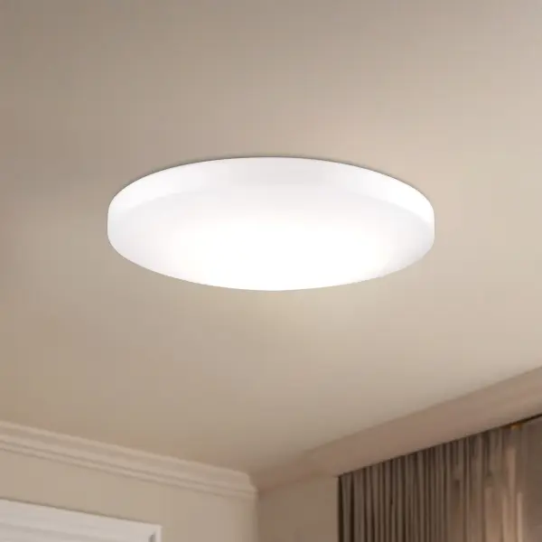 The Trafalgar 11" flush mount combines minimalist design with integrated LED technology, featuring a descending dome-shaped white glass shade and powder-coated white canopy. Perfect for modern spaces with low ceilings. - alternate view
