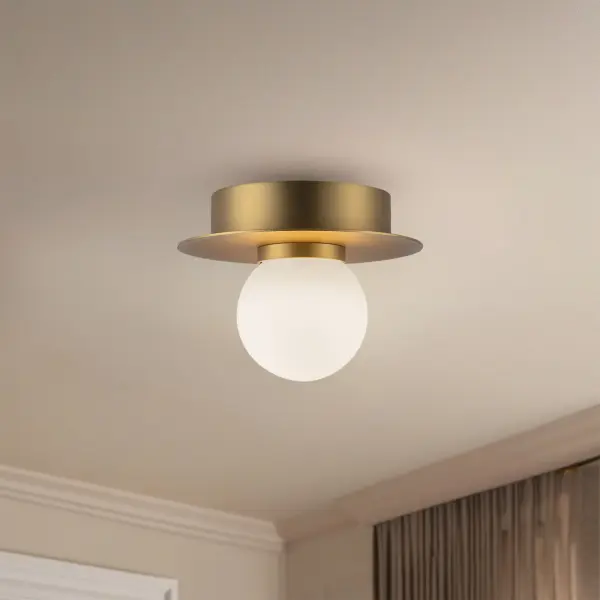 The Elixir flush mount combines sleek chrome disks with soft opal glass globes for a clean, contemporary look. Perfect for low-ceiling spaces, this 6-inch fixture delivers warm 3000K LED light with dimmable functionality. - alternate view