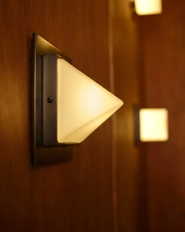 Jason Koharik's Mineral collection brings sculptural beauty to compact spaces. The 4-inch flush mount pairs urban bronze metalwork with luminous opal glass, creating soft, diffused light perfect for hallways, closets, and bedrooms. - alternate view