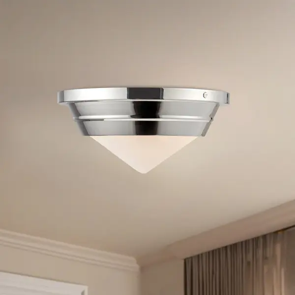 The Willard flush mount brings warmth and character to any space with its strong metal details and matte opal glass. Perfect for low-ceiling areas, this 10-inch fixture offers classic geometry with decorative appeal. - alternate view