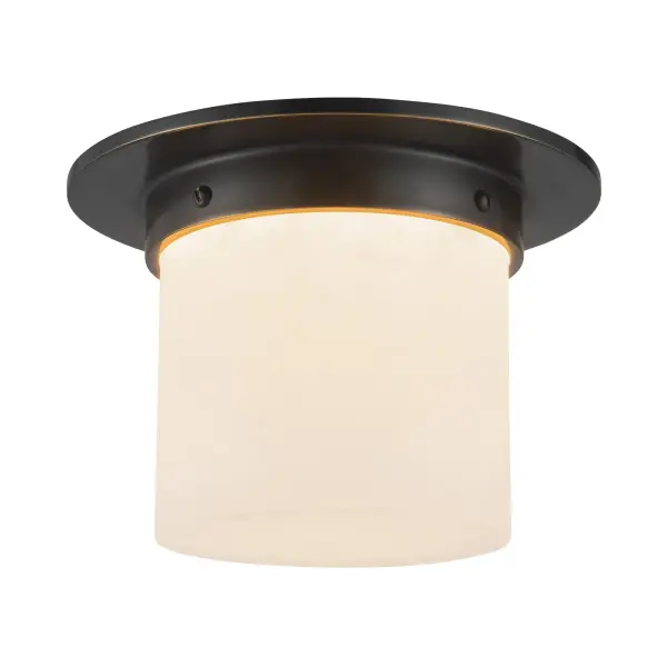 The Mineral Flush Mount transforms a utilitarian fixture into a work of art. Designer Jason Koharik's signature geometric approach pairs urban bronze framing with luminous opal glass, creating soft, diffused light perfect for intimate spaces.