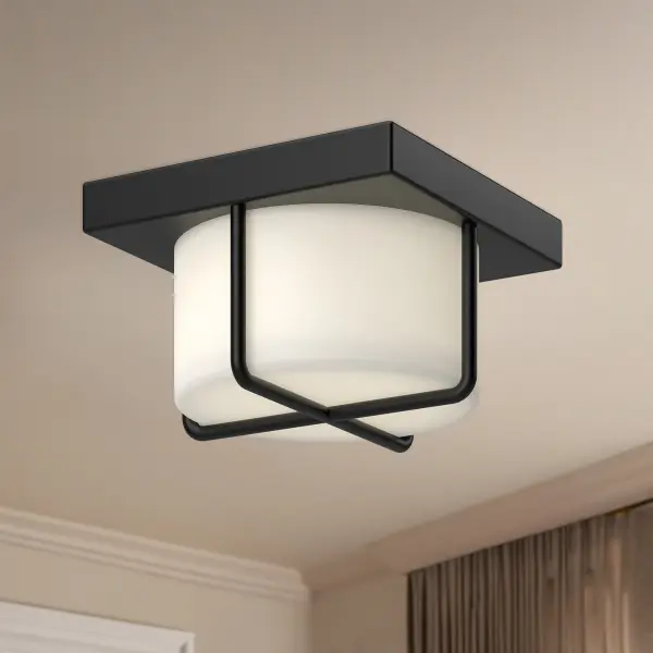 The Regalo 7-inch flush mount combines modern minimalism with decorative flair. Its opal glass diffuser wrapped in sculptural black metal details creates soft, even illumination perfect for smaller spaces and low ceilings. - alternate view
