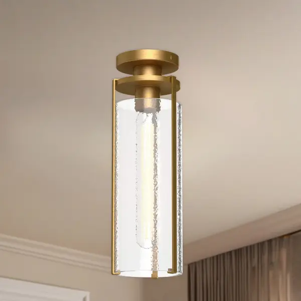 The Belmont 5-inch flush mount combines textured water glass with an aged gold finish for timeless appeal. Its compact profile makes it ideal for hallways, bathrooms, and entryways where ceiling clearance is limited. - alternate view