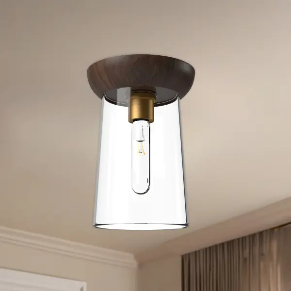 The Emil flush mount blends natural walnut wood with aged gold metallic accents for a sophisticated organic aesthetic. Its compact 7-inch profile makes it ideal for smaller spaces while delivering warm, inviting illumination. - alternate view