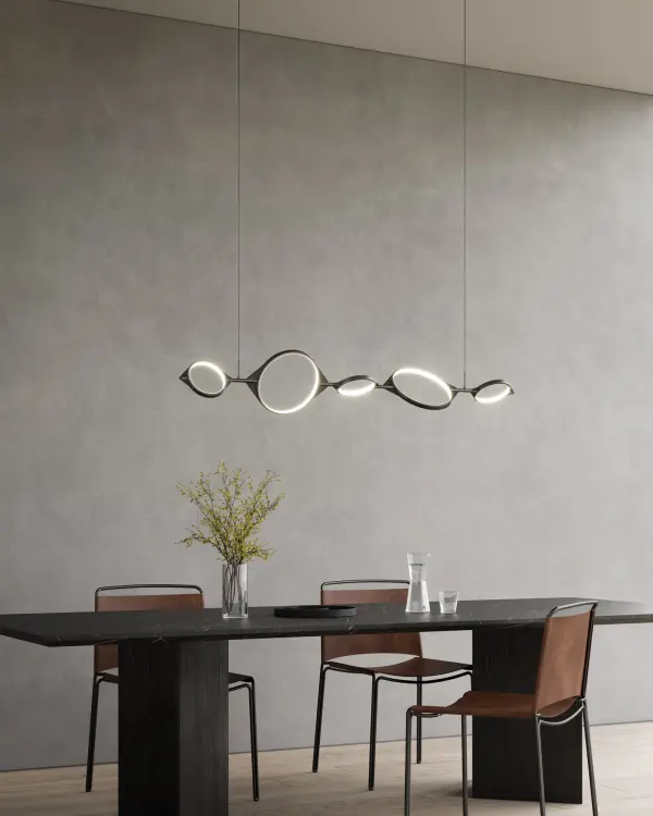 The Serif Linear Pendant transforms lighting into customizable art with its 57-inch span of adjustable geometric rings. Clean angular lines create floating light formations that adapt from minimal uniform arrangements to free-form sculptural statements. - alternate view