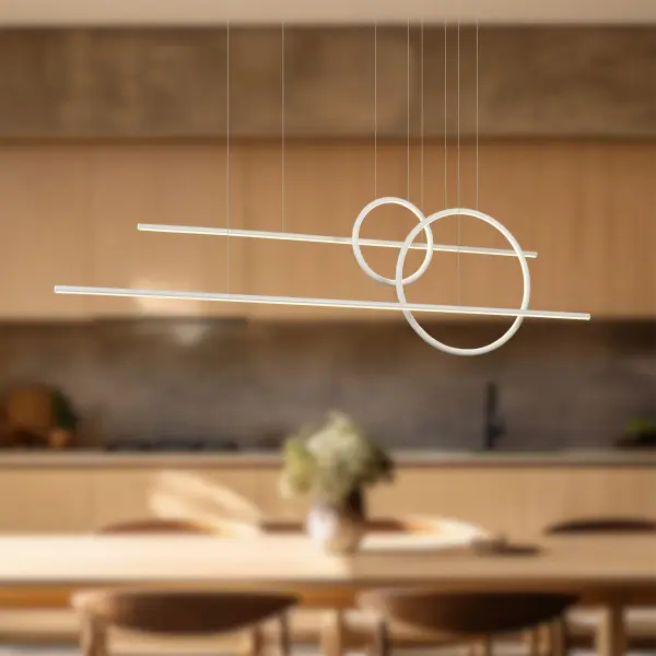 The Chute Calypso delivers dramatic visual impact with its 56-inch span of extruded aluminum cylinders and rings. Integrated LED with warm 3000K light and opal diffusers create ambient up/down lighting perfect for large spaces. - alternate view