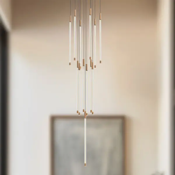 The Motif Multi Pendant combines clean modern lines with vintage-inspired LED filament technology. Its refractive cylinders create elegant light diffusion while the brushed gold finish adds warmth to contemporary spaces. - alternate view