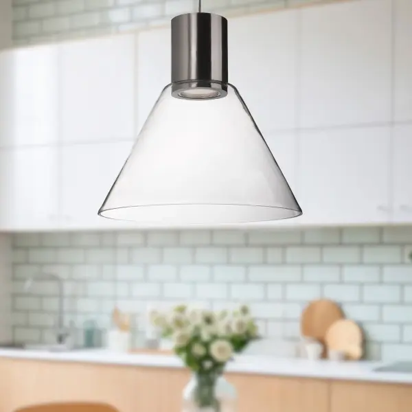 The Vanier pendant combines modern aesthetics with practical LED technology. Its trapezium-shaped clear glass and brushed nickel finish create a refined look perfect for contemporary kitchens and dining spaces. - alternate view