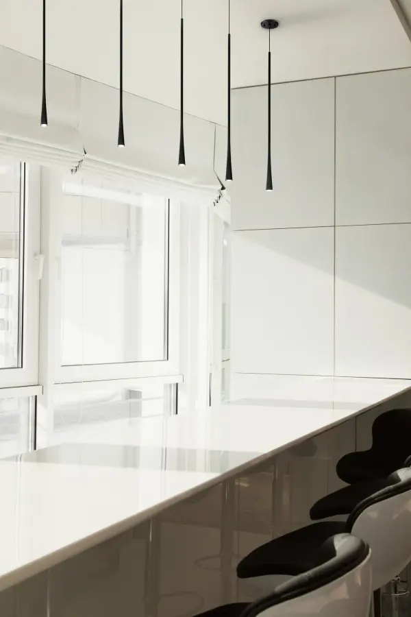 The Taper 32-inch pendant combines modern aesthetics with functional design, featuring a die-cast aluminum body with an elongated stem flowing into a conical shade. Integrated LED provides warm illumination while the tubular length serves as both design detail and hang-straight mechanism. - alternate view