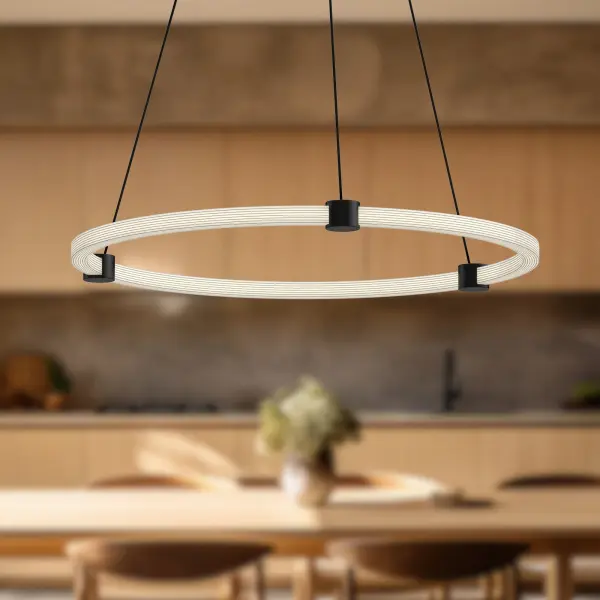The Bruni pendant combines contemporary design with practical functionality through its adjustable circular rings and integrated LED technology. The ribbed acrylic texture provides ample warm lighting while the brushed gold finish adds sophisticated elegance. - alternate view