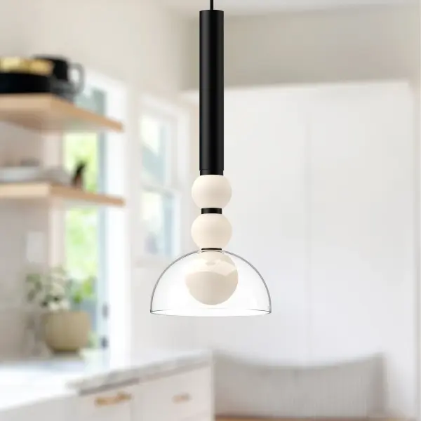 The Rise 6-inch pendant combines sleek modern design with practical integrated LED lighting. Its delicate opal sphere and clear glass shade deliver warm, ambient light perfect for intimate spaces and task areas. - alternate view