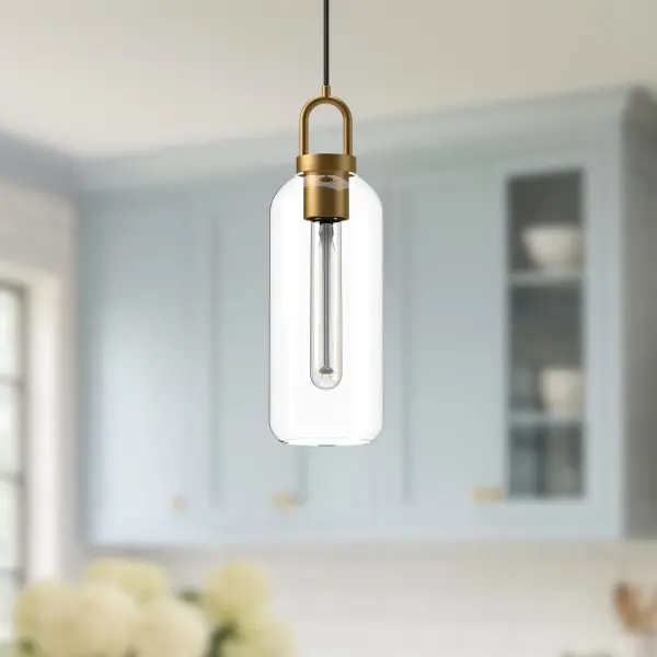 The Soji pendant brings traditional Japanese lantern aesthetics to modern spaces with its clean 5-inch silhouette. The aged gold finish paired with clear glass creates warm ambient lighting perfect for intimate settings. - alternate view