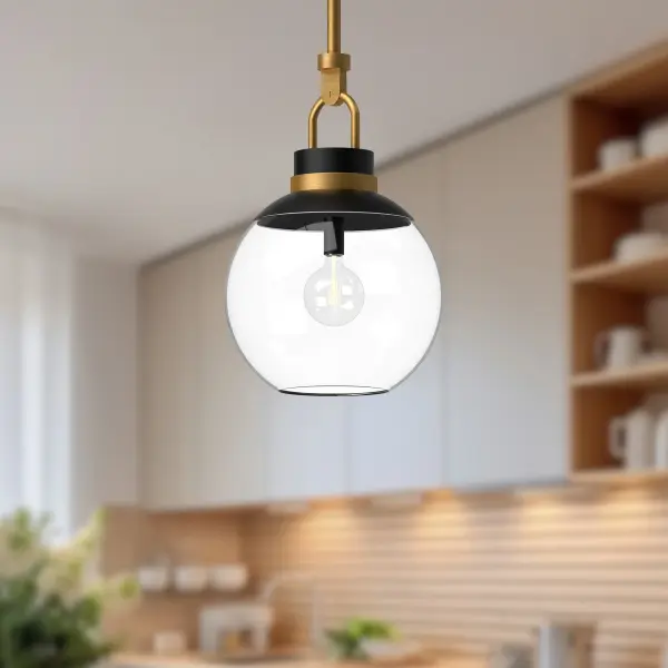 The Copperfield pendant brings magical details inspired by a magician's top hat, blending whimsy with classic sophistication. Its aged gold finish and clear glass shade create versatile appeal for traditional and contemporary spaces alike. - alternate view