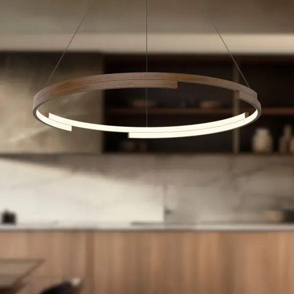 The Anello Minor features two layers of gently arched metal bands in an asymmetric design that creates visual interest from every angle. Integrated LED technology provides warm, energy-efficient lighting perfect for modern interiors. - alternate view