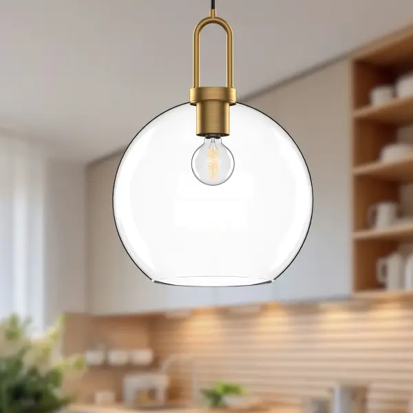 The Soji pendant brings serene Japanese lantern aesthetics to modern spaces. Its 10-inch clear glass globe paired with matte black detailing creates a clean, versatile look that transitions beautifully from day to night. - alternate view