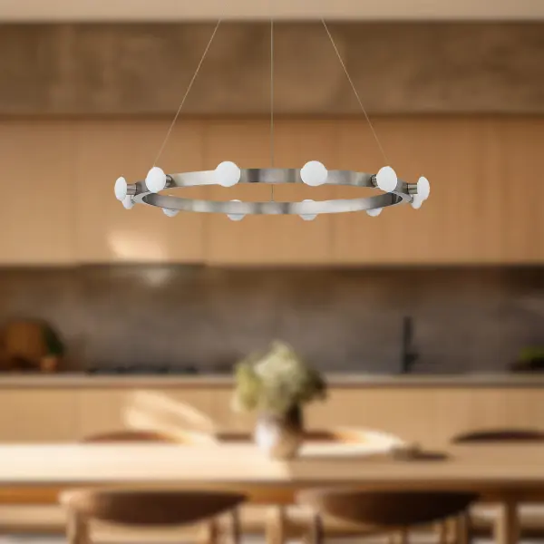 The Rezz pendant reimagines classic Hollywood style with opal glass diffusers dancing around a sleek matte black frame. Integrated LED with warm 3000K lighting creates ambiance while the minimal design adapts to various interiors. - alternate view