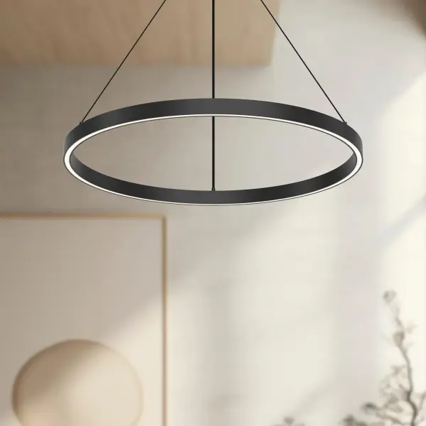 The Cerchio pendant combines minimalist design with functional up/down illumination. Its extruded aluminum construction and brushed gold finish create a sophisticated focal point perfect for modern kitchens and dining spaces. - alternate view