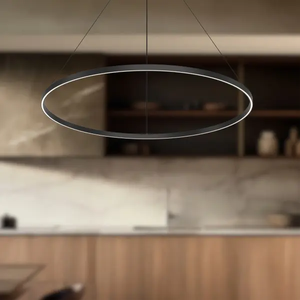 The Cerchio 48" pendant combines architectural elegance with functional illumination. Its extruded aluminum rectangular profile and brushed gold finish create a refined statement piece, while integrated LED technology provides warm ambient and task lighting. - alternate view