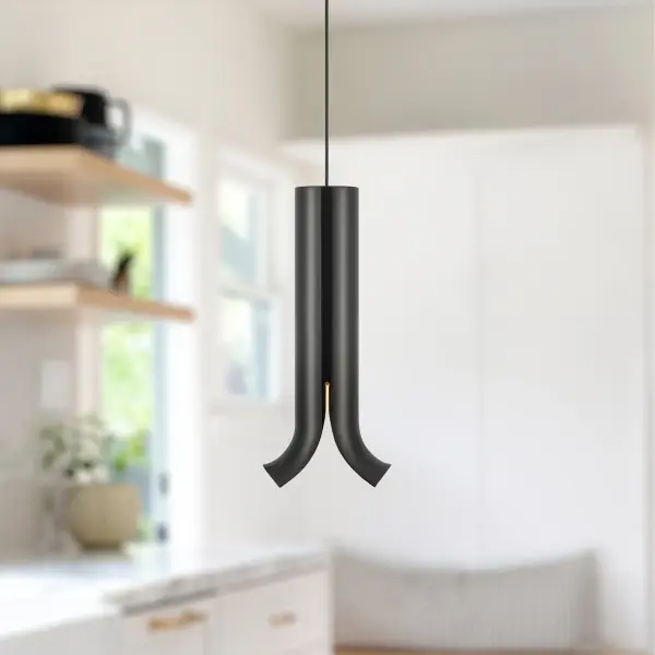 The Husk pendant brings nature-inspired elegance to contemporary spaces with its unique split metal frame that reveals a warm LED core. At 9 inches, it's perfectly sized for intimate spaces or grouped installations. - alternate view