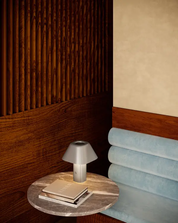 The Folio combines sculptural design with practical cordless functionality. Its vegan leather finish and smooth dimming control make it perfect for modern interiors seeking portable, refined accent lighting. - alternate view