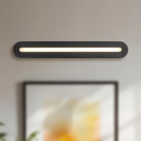 The Arco vanity light brings contemporary elegance to bathroom spaces with its distinctive pill-shaped silhouette and layered frame design. Featuring integrated 3000K LED technology for warm, energy-efficient illumination. - alternate view