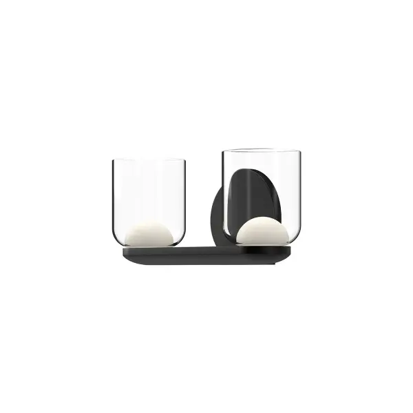 The Cedar vanity light combines contemporary styling with practical versatility. Its dual-layer glass design—frosted diffusers within clear shades—creates soft, flattering illumination perfect for bathrooms and powder rooms.