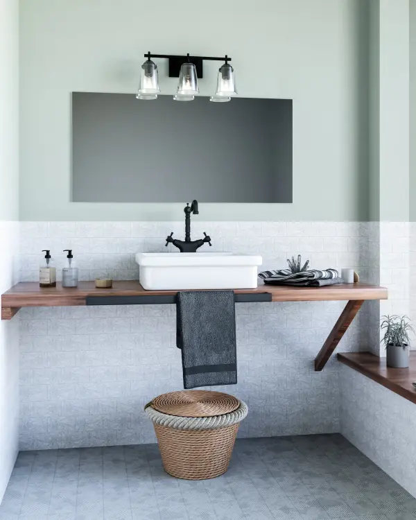 The Addison vanity light combines modern geometric metal framing with classic curved clear glass shades, creating a versatile fixture that bridges traditional and contemporary styles perfectly for bathroom vanities. - alternate view