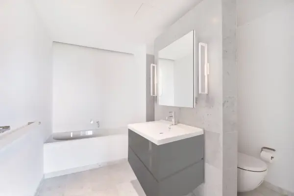 The Swivel wall sconce combines contemporary design with practical functionality. Its 48-inch length and adjustable rotational arm provide versatile directional lighting, while the machined aluminum construction ensures durability. - alternate view