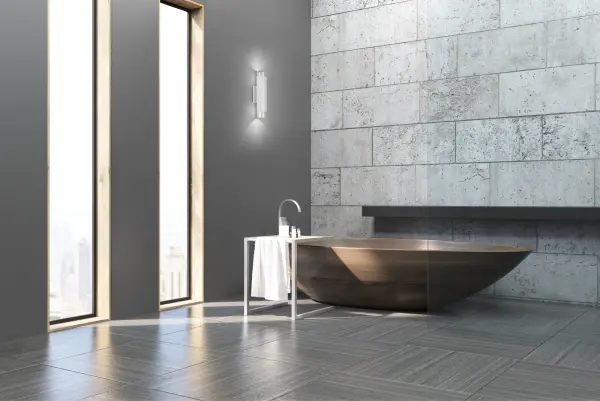 The Dela 16-inch wall sconce brings Art Deco glamour to contemporary spaces with its distinctive two-tone metallic finish and integrated LED technology. Perfect for bathrooms and hallways where style meets function. - alternate view