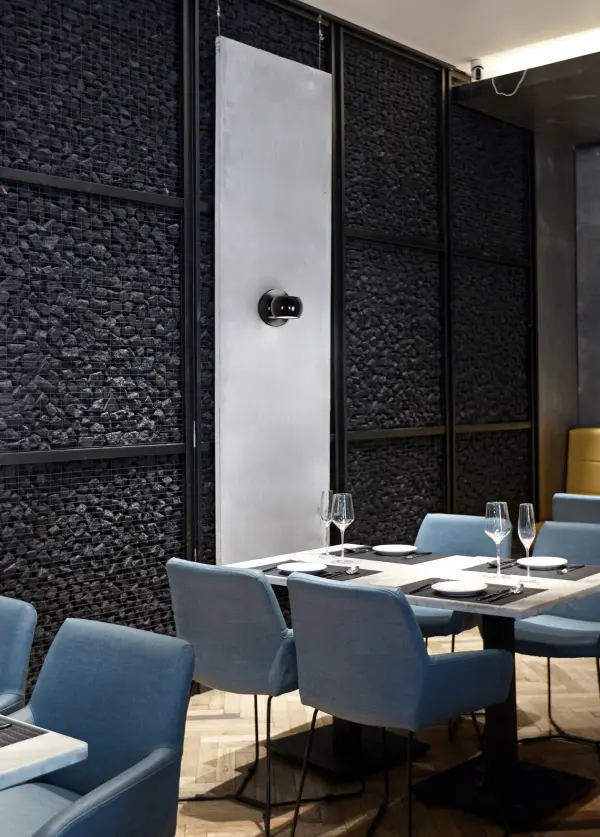 The Flux 4-inch wall sconce combines contemporary design with practical functionality. Its cast aluminum drum houses a frosted glass diffuser with magnetic connectors for 360° rotation. Touch-actuated dimming and integrated LED make it ideal for modern bathrooms and hallways. - alternate view
