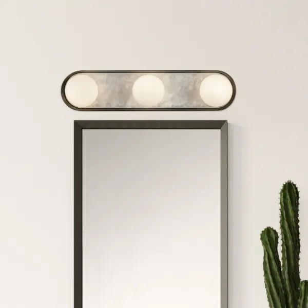 The Alonso combines forged metal in Urban Bronze with hand-carved alabaster shades for a stunning blend of traditional craftsmanship and modern design. Integrated LED provides warm illumination perfect for bathrooms and entryways. - alternate view
